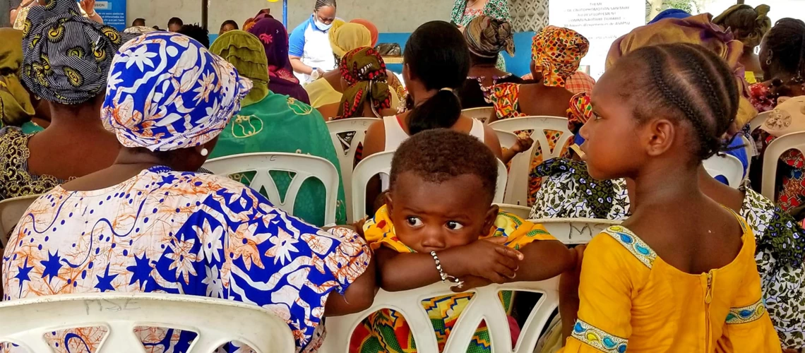 Women and children at a health center in Cote d'Ivoire