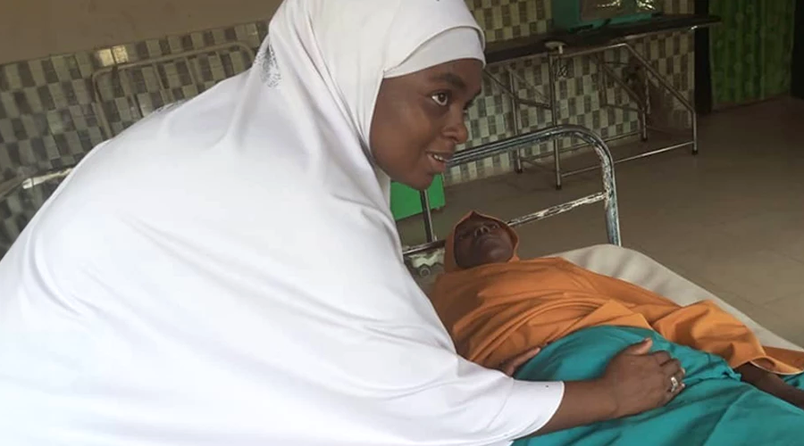 Midwife Fauzziya Abubakar Abare tends to a patient in Gombe State, Nigeria